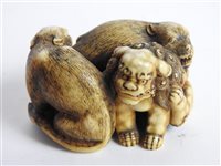 Lot 312 - A Japanese carved ivory okimono of a shishi
