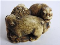 Lot 312 - A Japanese carved ivory okimono of a shishi