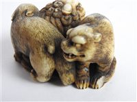 Lot 312 - A Japanese carved ivory okimono of a shishi