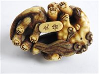 Lot 312 - A Japanese carved ivory okimono of a shishi