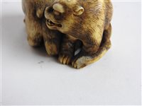 Lot 312 - A Japanese carved ivory okimono of a shishi