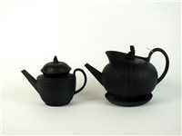 Lot 34 - Two English black basalt teapots and covers