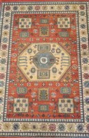 Lot 804 - A machine made rug of Kazak design