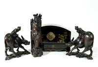 Lot 593 - A pair of early 20th century Chinese carved hardwood groups of figures riding water buffalo