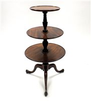 Lot 554 - A late George III mahogany three-tier dumbwaiter