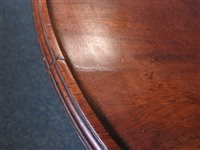 Lot 554 - A late George III mahogany three-tier dumbwaiter