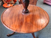 Lot 554 - A late George III mahogany three-tier dumbwaiter