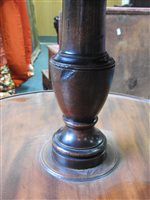 Lot 554 - A late George III mahogany three-tier dumbwaiter