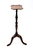 Lot 559 - A mahogany torchere