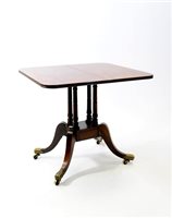 Lot 932 - A plum pudding mahogany and simulated rosewood table