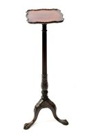 Lot 580 - A Chippendale revival mahogany torchere stand