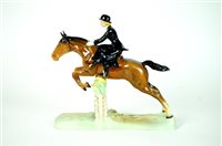 Lot 102 - A Beswick model of a Huntswoman Jumping a Fence