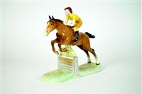 Lot 103 - A Beswick model of a Girl on a Jumping Horse