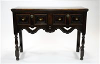 Lot 349 - A small stained oak dresser base / side-table in the Jacobean manner