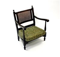 Lot 338 - A small oak framed bergere armchair