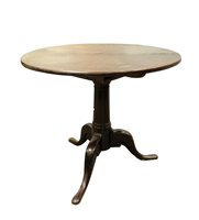Lot 355 - A 19th century mahogany tripod table.