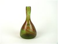 Lot 20 - A Clutha glass bottle vase designed by Christopher Dresser