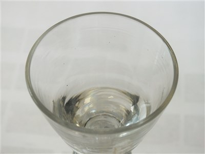 Lot 101 - A heavy baluster wine or dram glass, circa 1710
