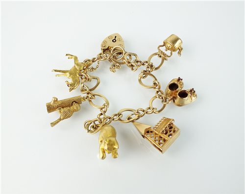 Lot 164 - A 9ct gold charm bracelet