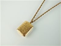 Lot 173 - A yellow metal locket on chain