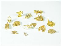 Lot 33 - A collection of 9ct gold charms