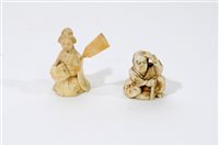 Lot 217 - A Japanese carved ivory okimono of a man with a noh mask