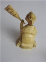 Lot 217 - A Japanese carved ivory okimono of a man with a noh mask