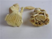 Lot 217 - A Japanese carved ivory okimono of a man with a noh mask