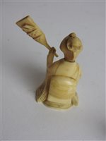Lot 217 - A Japanese carved ivory okimono of a man with a noh mask