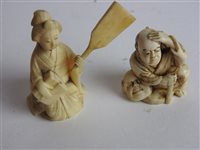 Lot 217 - A Japanese carved ivory okimono of a man with a noh mask