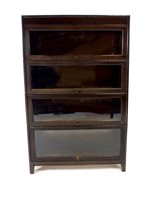 Lot 754 - A four sectional stained oak stacking bookcase