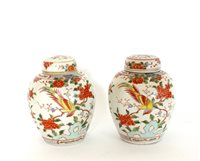 Lot 358 - A pair of Chinese famille rose porcelain vases, and covers, 20th century