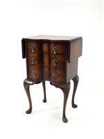 Lot 858 - A small reproduction serpentine chest of three drawers