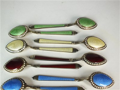 Lot 112 - A set of American silver gilt and enamel spoons