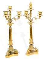 Lot 182 - A pair of Charles X gilt bronze candlesticks