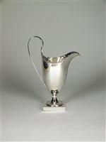 Lot 86 - A helmet silver cream jug