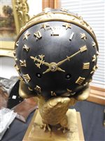 Lot 477 - An Empire style ormolu and bronze eagle and globe mantel clock