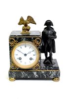 Lot 203 - A French bronze and ormolu mounted variegated marble mantel clock