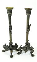 Lot 635 - A pair of late 19th century cast bronze candlesticks