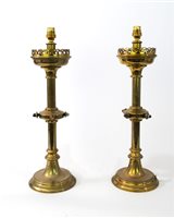 Lot 403 - A pair of Victorian brass Gothic revival candlesticks