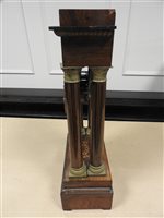 Lot 210 - A French rosewood and inlaid portico clock