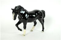 Lot 156 - A Beswick Collector's Club model of a Black Stocky Jogging Mare