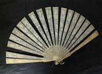 Lot 492 - A Canton carved ivory brise fan