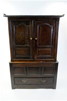 Lot 676 - An 18th century carved oak linen press