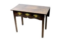 Lot 531 - A George III oak drop leaf side table