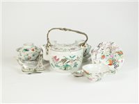 Lot 345 - A set of four Chinese famille rose porcelain cups, covers and stands