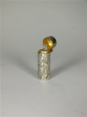 Lot 104 - A cased silver mounted scent bottle