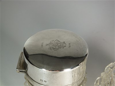 Lot 400 - Two silver topped glass dressing table bottles