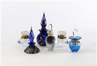 Lot 177 - A pair of faceted glass inkwells and four scent bottles