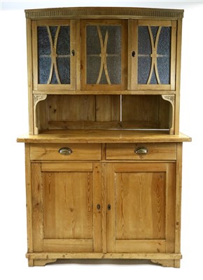 Lot 387 - A small scrubbed pine kitchen dresser with a glazed cupboard top